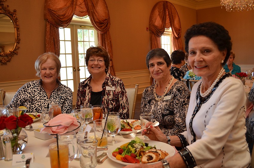 Margaret Wolohan, Carold Spalding, Janice Russo and Rita Polansky are seated for the Women's Club luncheon.