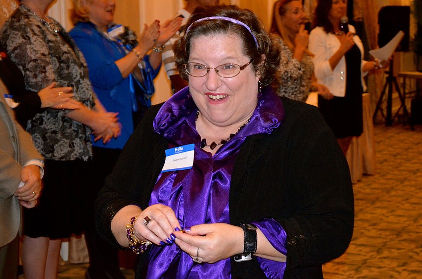 Laurie Russell is excited about recognition she received for three years of service.