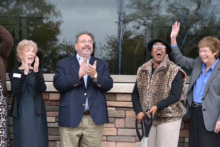 Commissioner Carolyn Mason cuts the ribbon to open the new Gulf Gate Library.