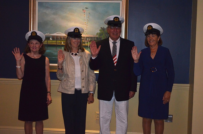 Scribe Maureen Shea, Purser Mary Kimura, Vice Commodore Jim Fox and Commodore Kathy Sever are sworn in.