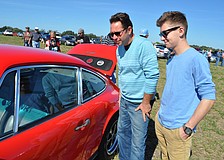 Patrick and Olivier Bellanger check out a classic Porsche, their favorite.