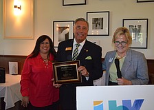 Andrew Vac, of RE/MAX, with 2014 Chairman of the Board Yvonne Schloss and President Gail Loefgren, accepts his Chairmanâ€™s Award.