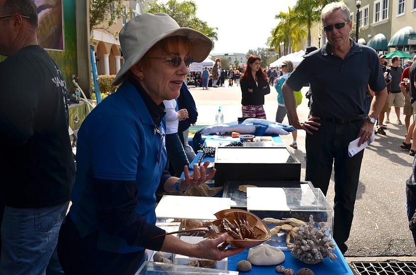 Hilary Jones talks to a crowd about horseshoe crabs.