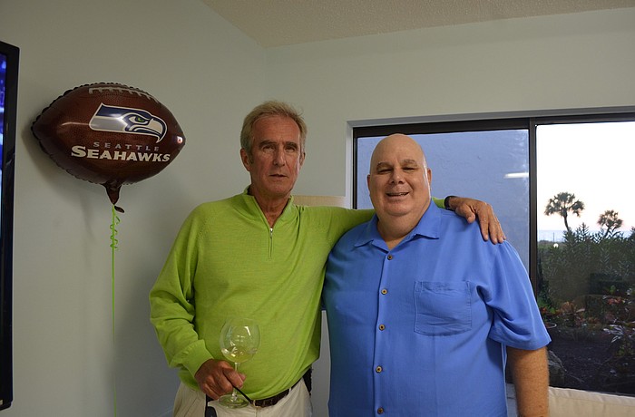 Seahawks fans George Stensgard and Matt Brieske cheer on their team at Longboat Terrace.