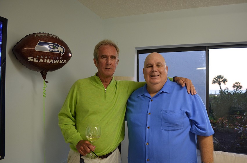 Seahawks fans George Stensgard and Matt Brieske cheer on their team at Longboat Terrace.