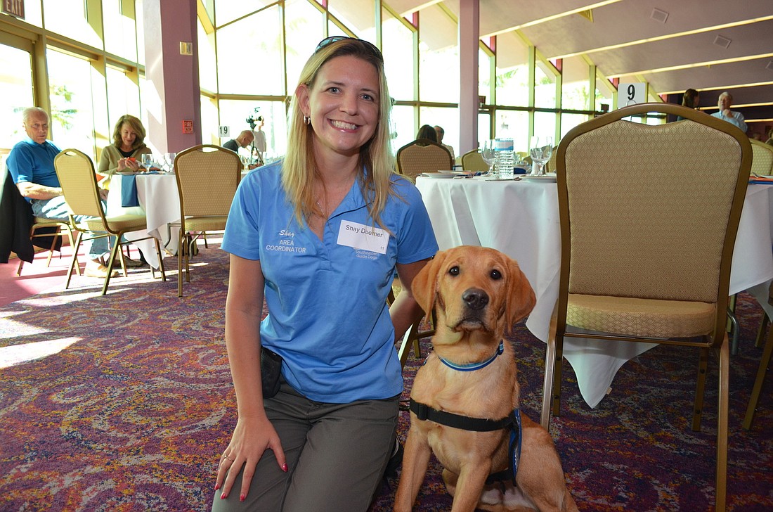 Area Coordinator for Southeastern Guide Dogs and puppy raiser Shay Doerner with 6-month-old Rocky.