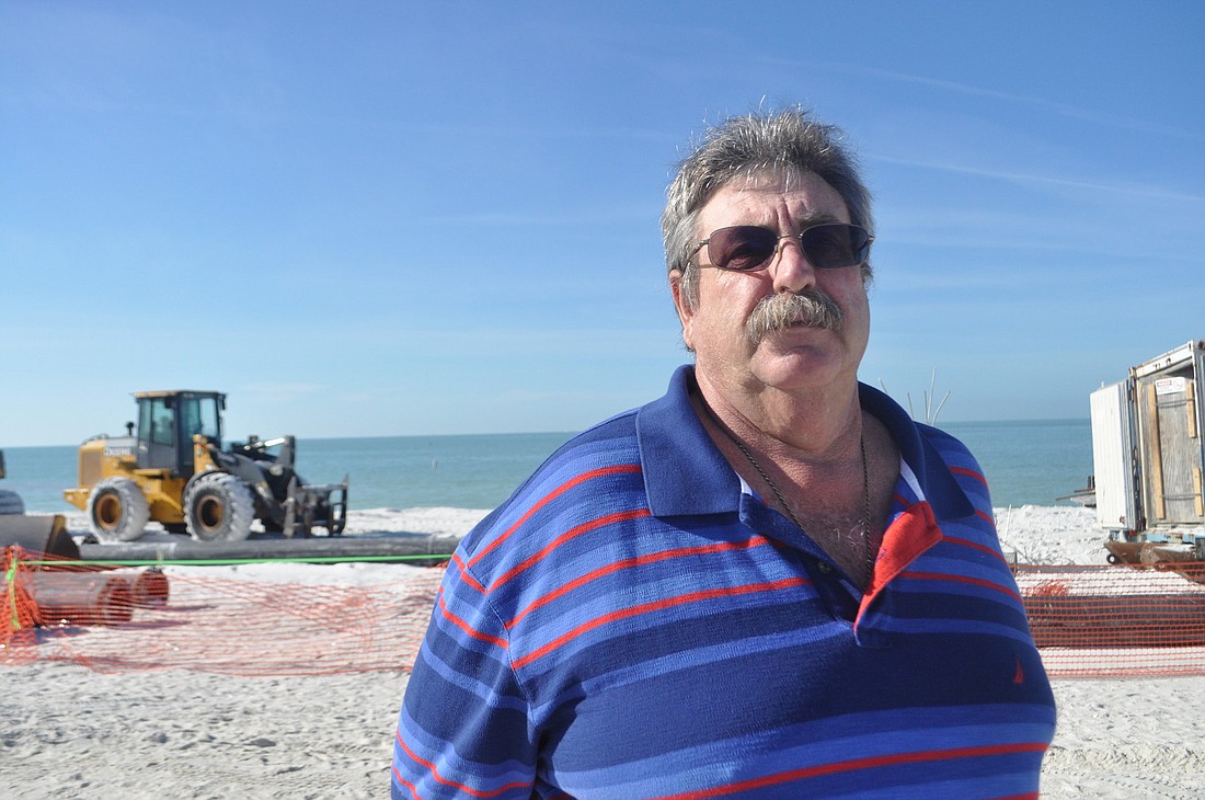 Lido Key Residents Association President Carl Shoffstall is keeping a close watch on the ongoing post-Tropical Storm Debby shoreline renourishment project. Photo by David Conway