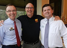 Brian Lamb, Gris Bettle and Jason Nestlerode make new friends and contacts.