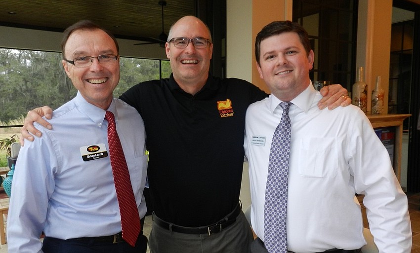 Brian Lamb, Gris Bettle and Jason Nestlerode make new friends and contacts.