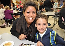 Abbey Widmer enjoys muffins with her son, Tyson, 7.