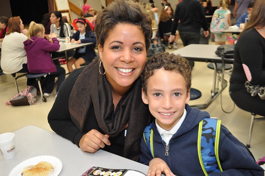 Abbey Widmer enjoys muffins with her son, Tyson, 7.