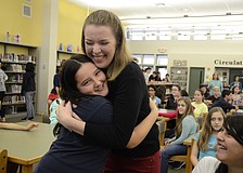 Christi McDowell-Cameron, International Baccalaureate Coordinator for Brookside Middle, asked for hugs after awarded Middle School Teacher of the Year. Michelle McGuire, 12, was first.