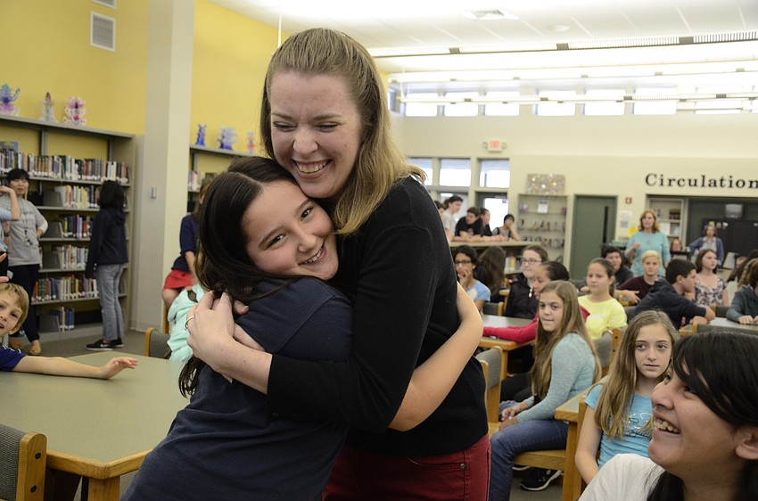 Christi McDowell-Cameron, International Baccalaureate Coordinator for Brookside Middle, asked for hugs after awarded Middle School Teacher of the Year. Michelle McGuire, 12, was first.