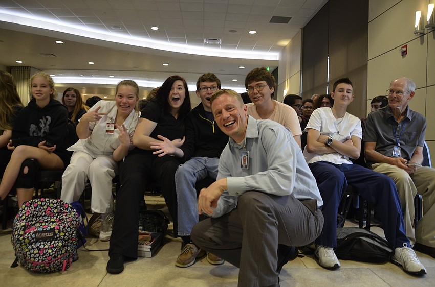 Russell Finger jumps in front of his students. 