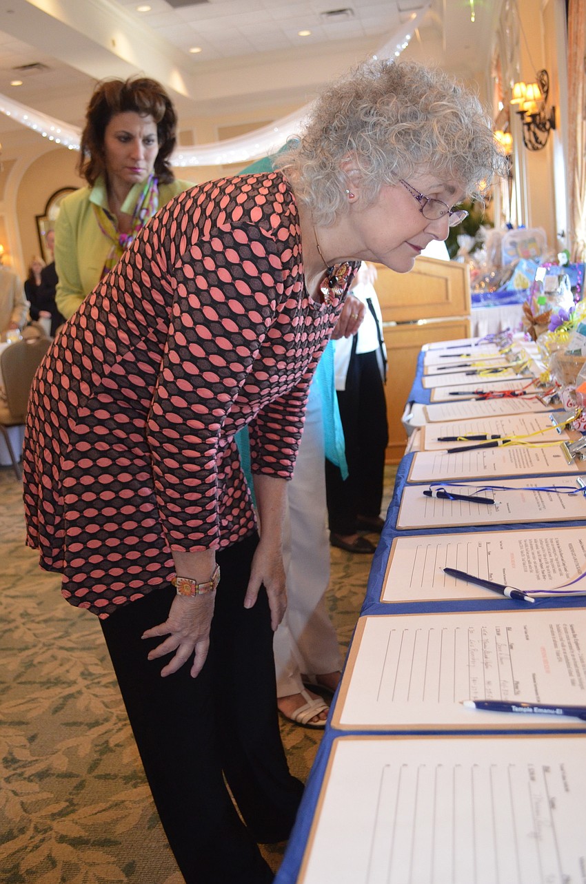 Diane Browne-Sterdt browses the gift baskets.