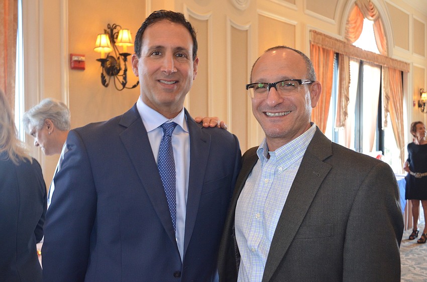 Ian Howard and Bruce Gilburne support their wives, who are eau members of the sisterhood group.