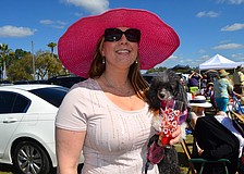 Keffie Lancaster and her dog, Koukla, enjoy a breezy afternoon and a polo match.