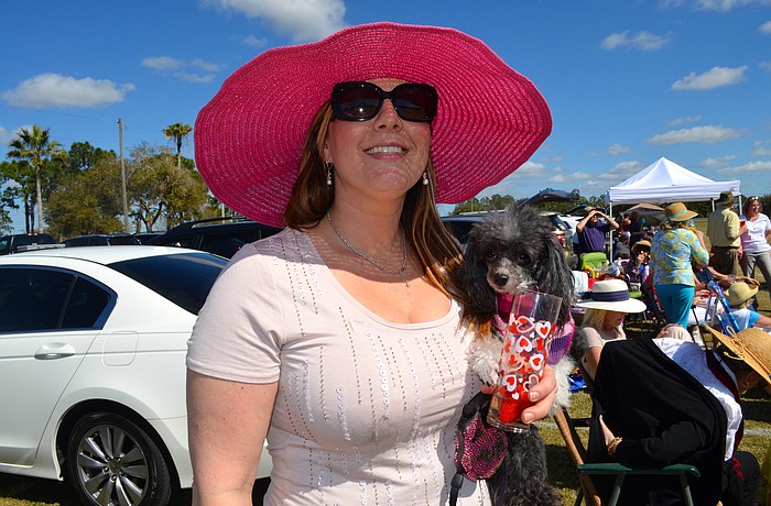 Keffie Lancaster and her dog, Koukla, enjoy a breezy afternoon and a polo match.