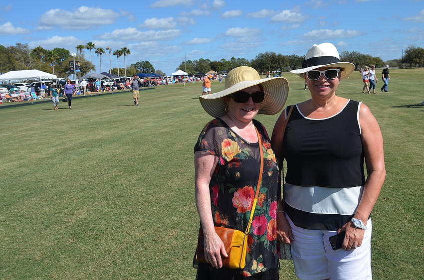 Judy Freeman and April Stead check out the polo field during an intermission.