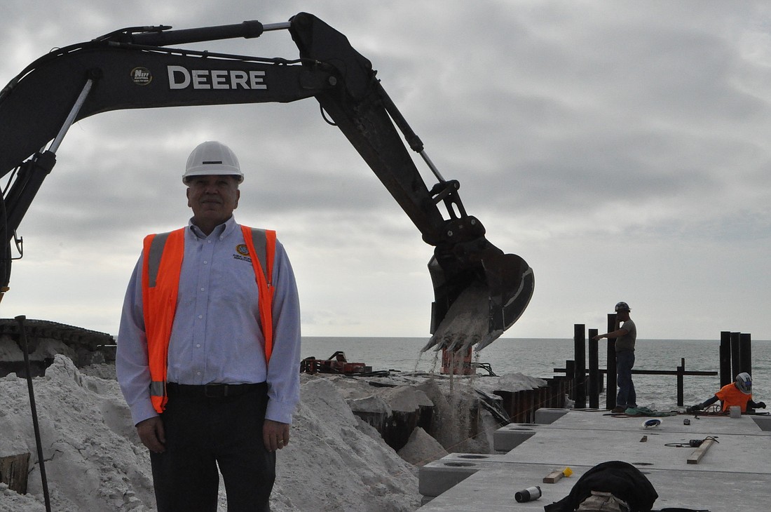Longboat Key Public Works Director Juan Florensa stands on the north-end beach, where two groins are currently under construction to control erosion. Photo by Robin Hartill