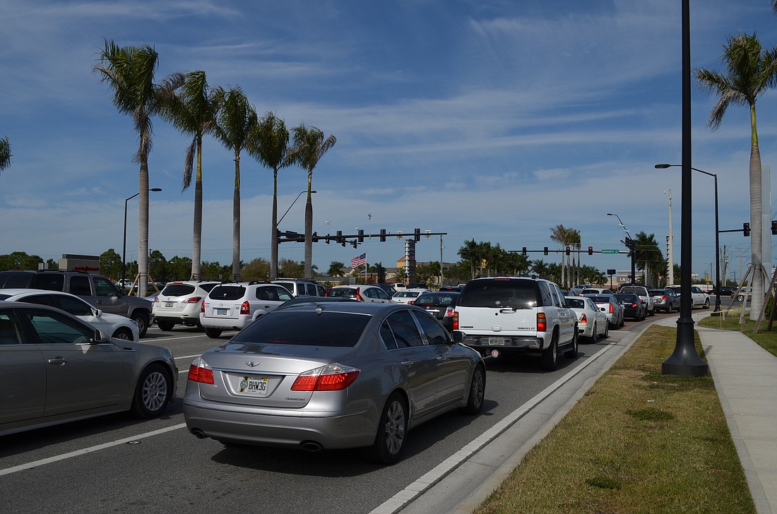 Traffic has increased around The Mall at University Town Center, but the county doesn't yet have data to determine by how much. To manage the flow of traffic, it manually changes the traffic signals during peak times. Kurt Schultheis