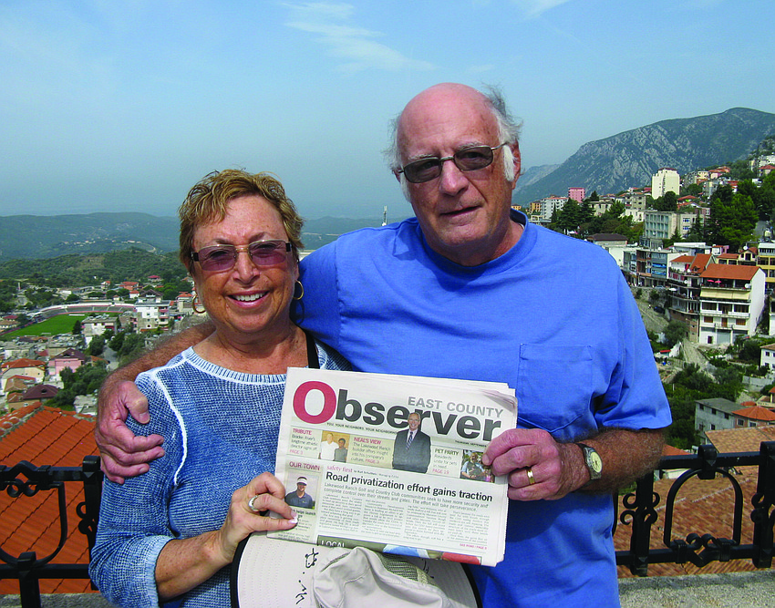 ALBANIAN ENCORE. Marlene and Jim Kitchell pose with their Observer at the Skanderbeg Museum, which overlooks Kruja, Albania. The couple enjoyed the stop as part of a cruise from Monte Carlo, Monaco, to Venice, Italy.
