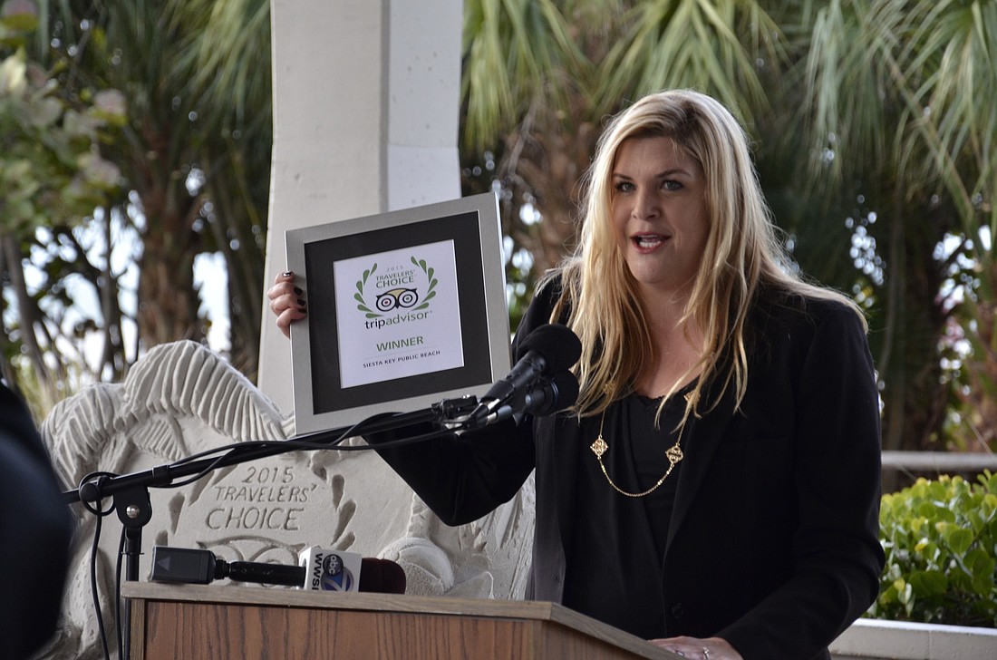 Melissa Surane, the Florida representative for TripAdvisor, presented the award this morning at Siesta Key Pavilion.