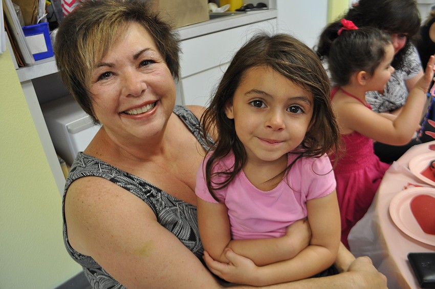 Barbara Matazinski attends with her granddaughter, Alessandra Santiago, 4.