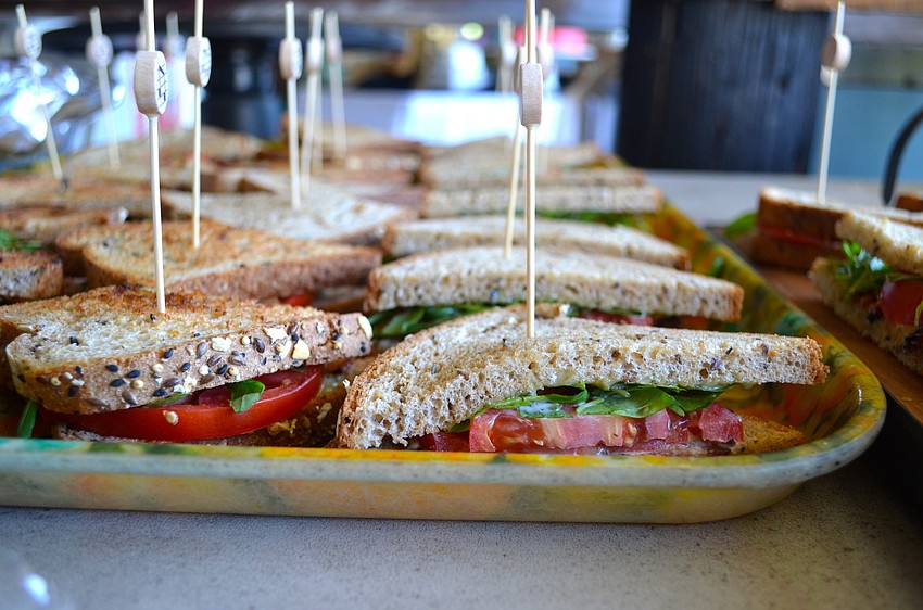 Event participants learned how to make tomato sandwiches.