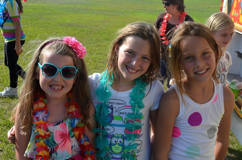 Alanna Bray, Katie Hardesty and Mia Reddick wait for their frozen snack.