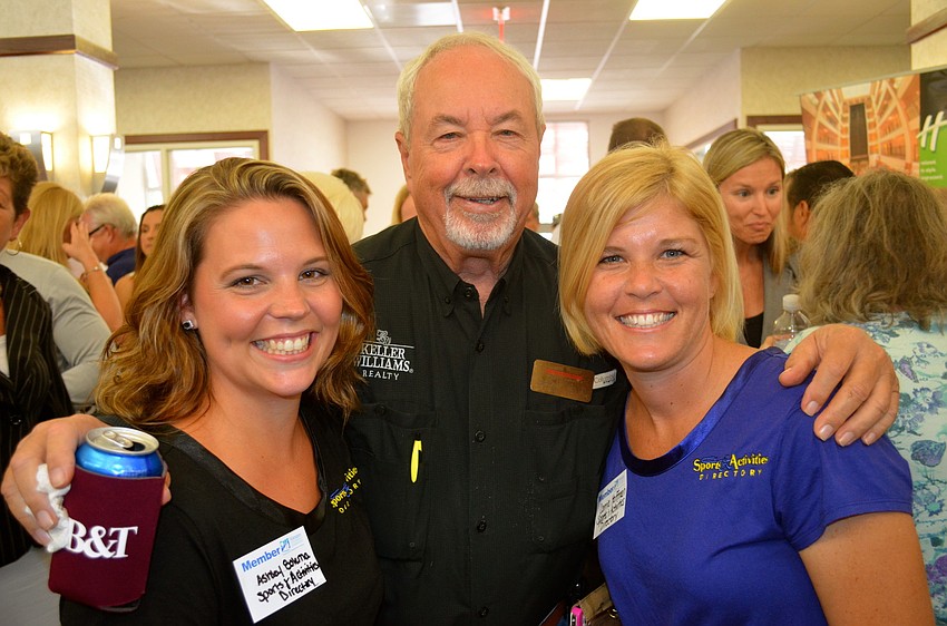 Richard Curtis stands flanked by Ashley Bolema and Corrie Hoffman â€” his 