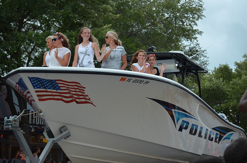 The Sarasota Police Departmentâ€™s boat goes down Main Street.