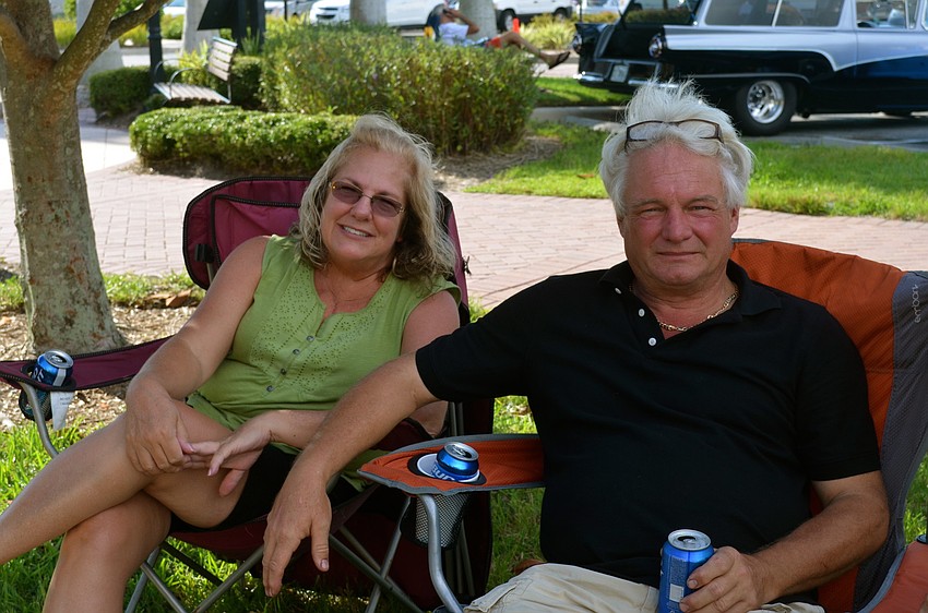 Marie Sansen and Kim Pauly enjoy cold drinks on a warm evening.