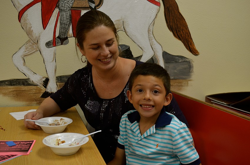 Johana Villegas and Sebastian Rivera enjoy their ice cream.