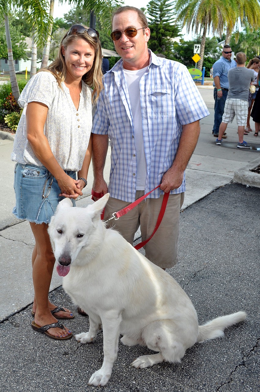 Kim and David Rich with Quinn, their white German Shepard