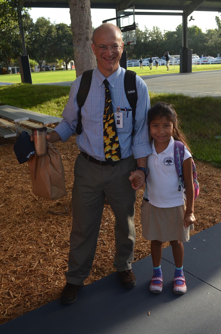 ODA Teacher Derek Wilberg walks daughter, Maddie Walsh, to her second grade classroom.
