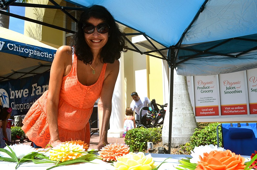 Elodie Waschke sells flower-shaped candles.