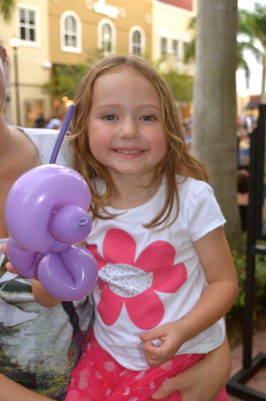 Zoey Kollet shows off her balloon dog.