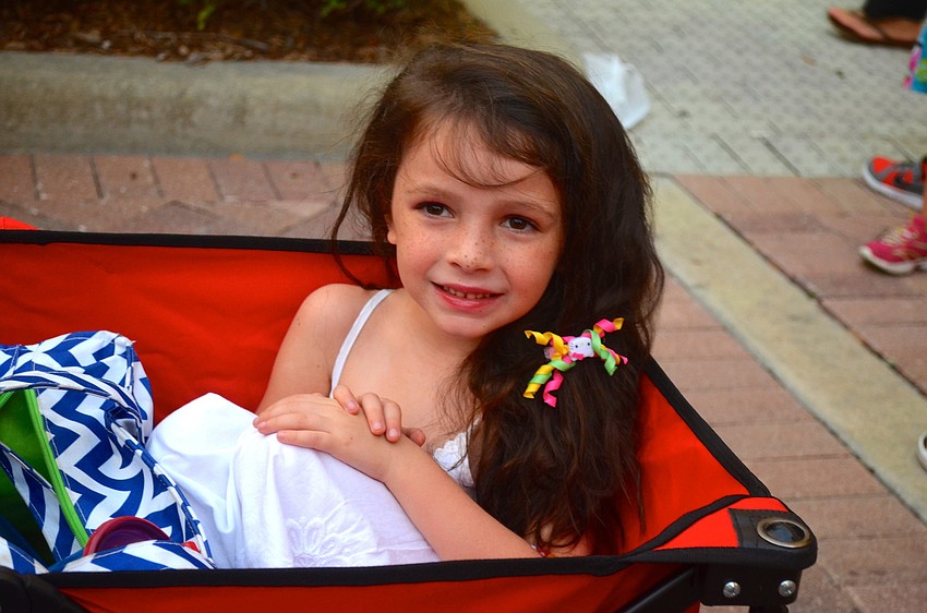 Madison Finley enjoys being pulled around in a wagon.
