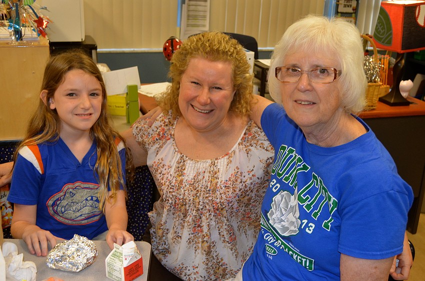 Three generations â€” Emily and Carrie Ellis, and Margie Kolde.
