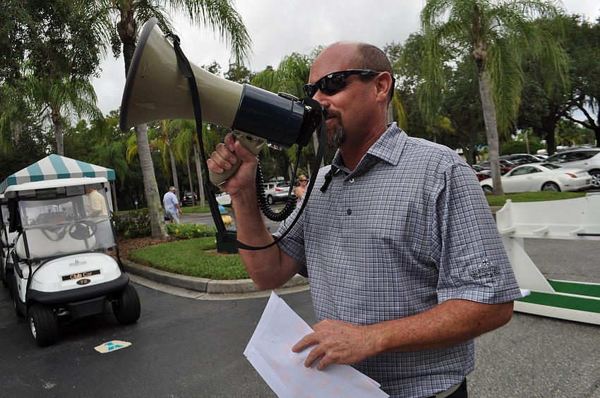 Head golf professional Ashley Hayden gets golfers ready for their shotgun start.