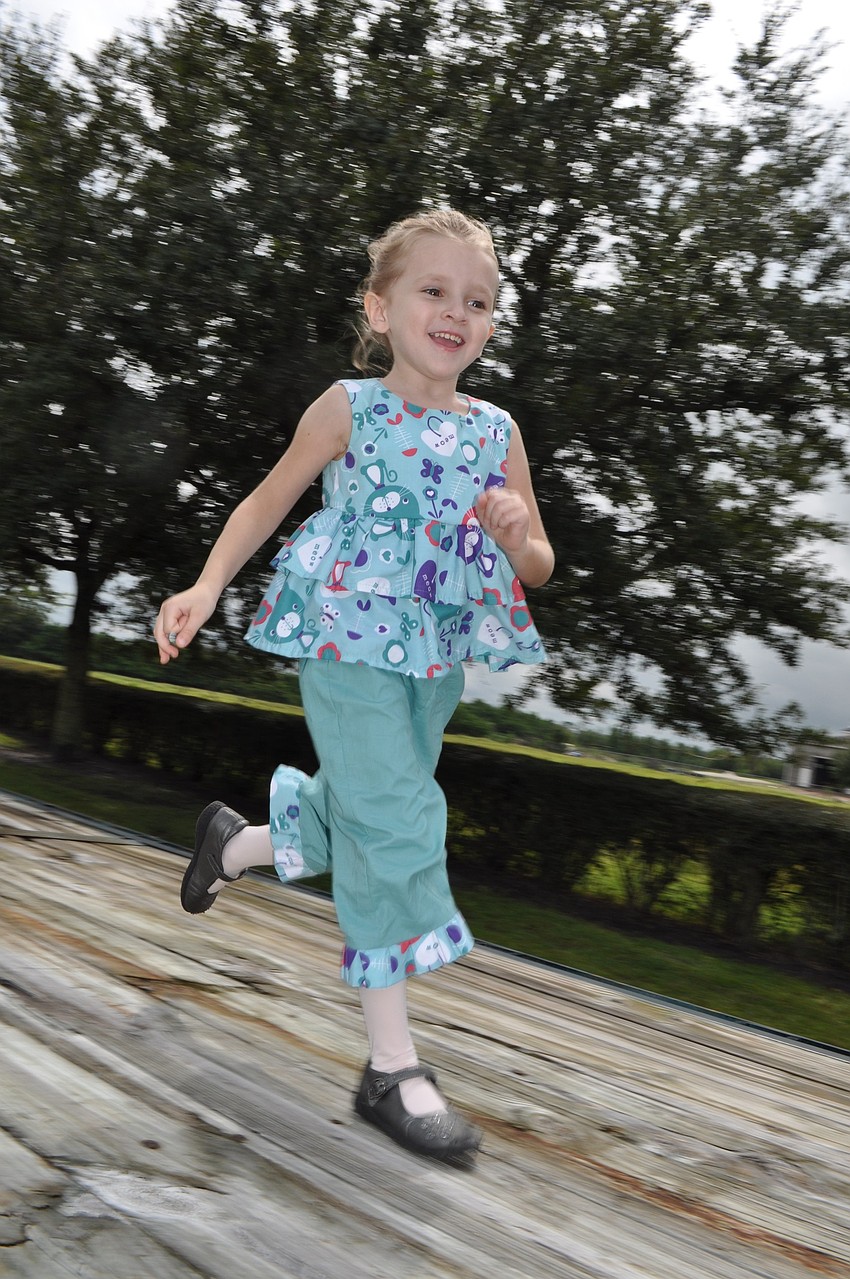 Janie Longabach races another child.