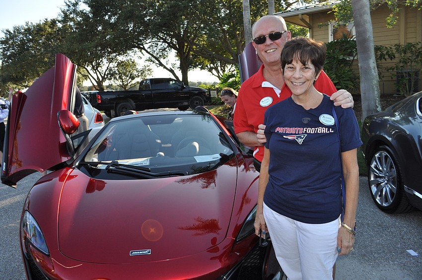Larry and Toni Richards, of Key Solution Real Estate Group, check out cars on display.