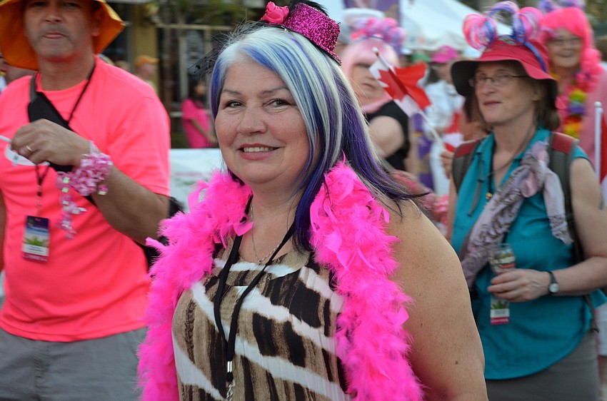Terri Andrews marches beside other breast cancer survivors and their families.