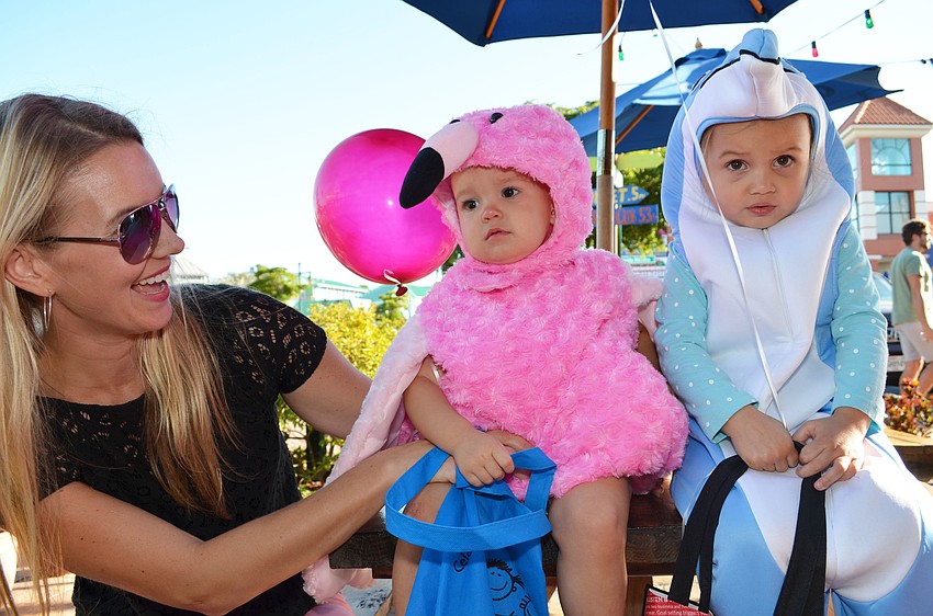 Kristy Ochsendorf with her daughters Lyla and Jessie dressed as a flamingo and dolphin.