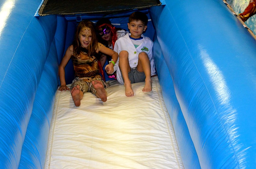 Esther Goldsman and Nikita Moroz brace for a slide ride.