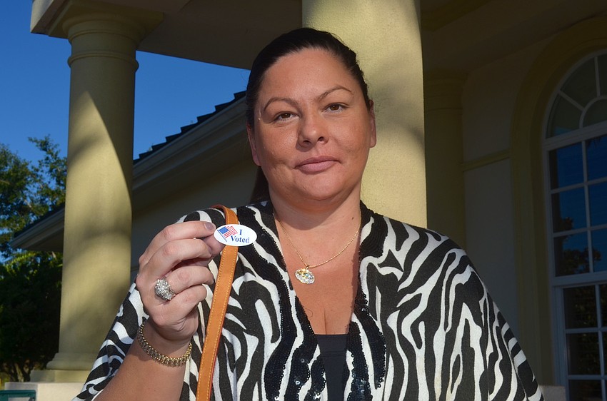 Jessica Maule makes time before work to vote.