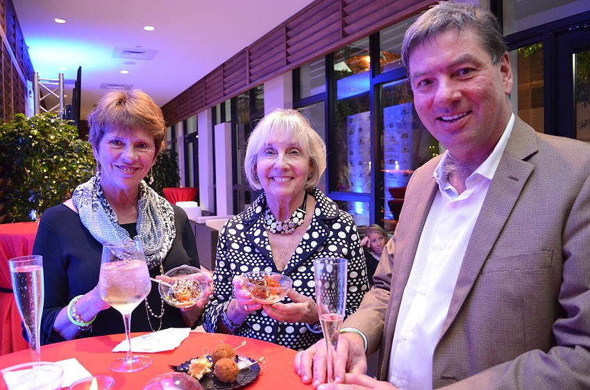 Joan Evans, Gloria Lundy and Mart Solu enjoy the appetizer from Jack Dusty.