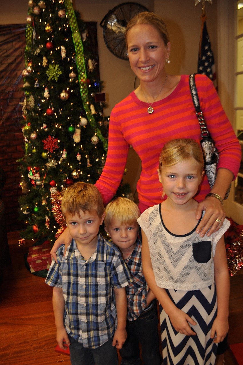 Ali Griffin readies to visit Santa with her children, Jaxon, Trey and Payton.