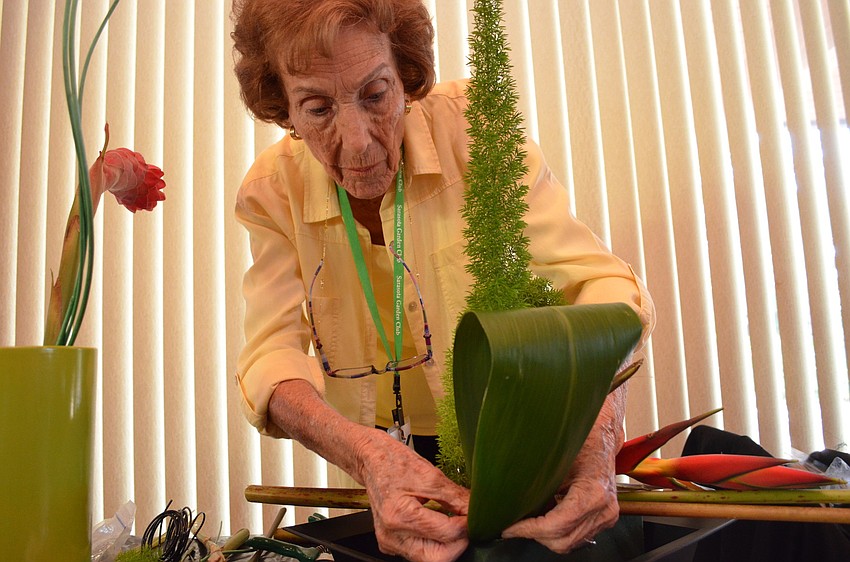 Eleanor Yates tinkers with her design that proved to be the favorite and overall winner.